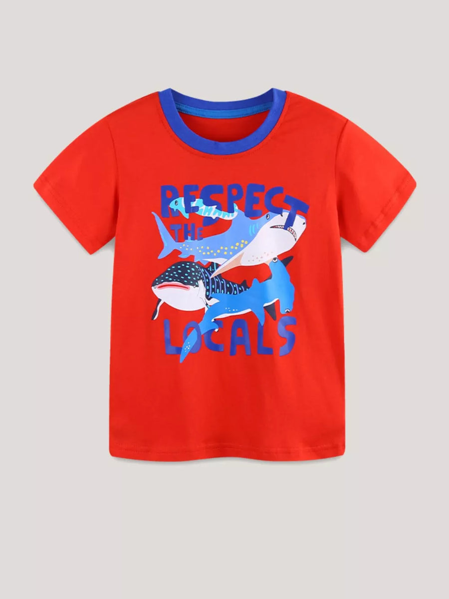 Children's red t-shirt with blue trim and cartoon sharks graphic that says Respect The Locals.