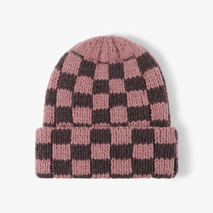 Checkerboard knit beanie in Dusty Pink and dark grey with a cuffed brim.