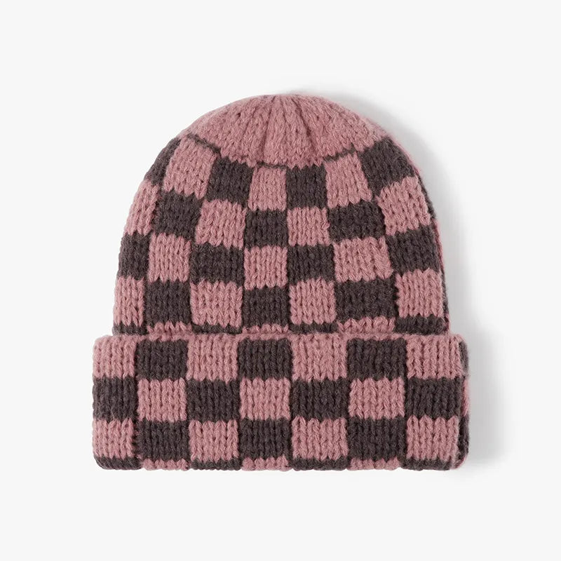 Checkerboard knit beanie in Dusty Pink and dark grey with a cuffed brim.