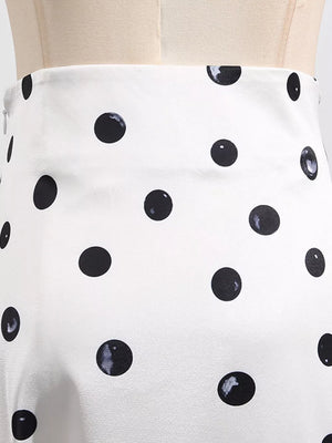 White polka dot skirt with black circles.