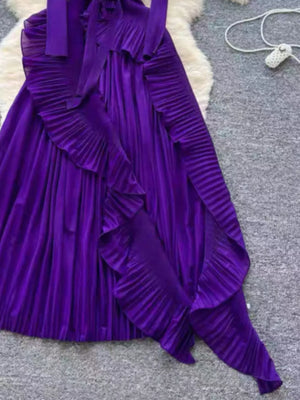 Purple midi dress with ruffled pleated skirt and bow neckline
