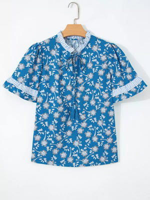 Blue floral cotton blouse with ruffle sleeves and tie neck