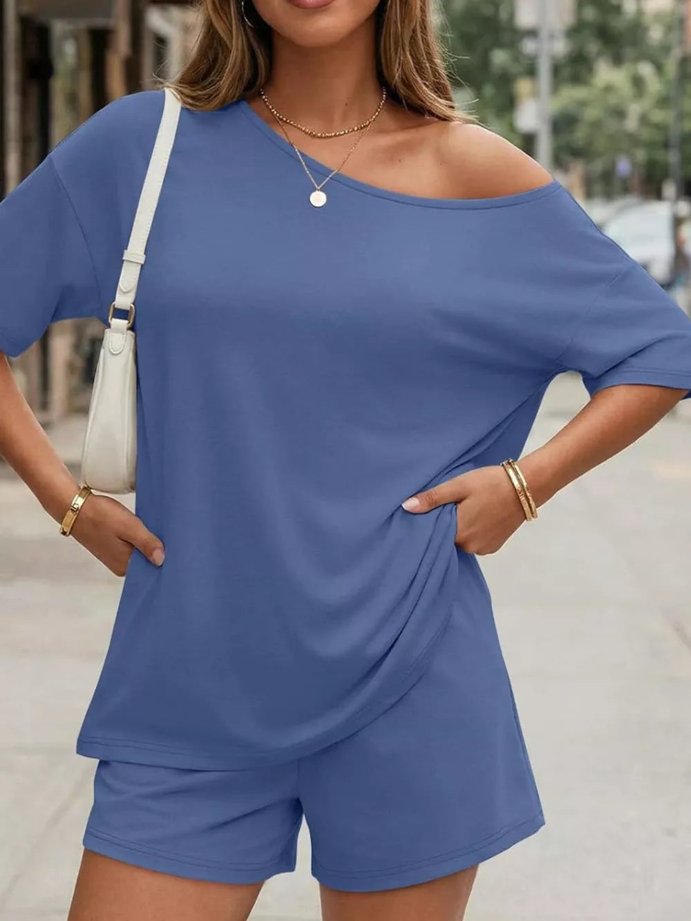 Blue asymmetrical one-shoulder top and shorts set with pockets