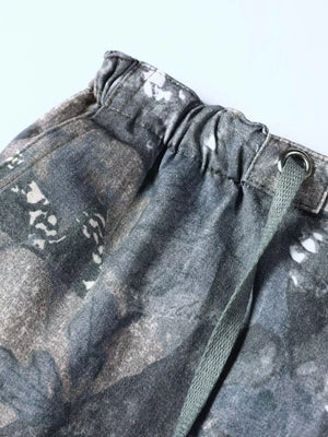 Men's camouflage cargo sweatpants with drawstring waist and metal eyelet detail.