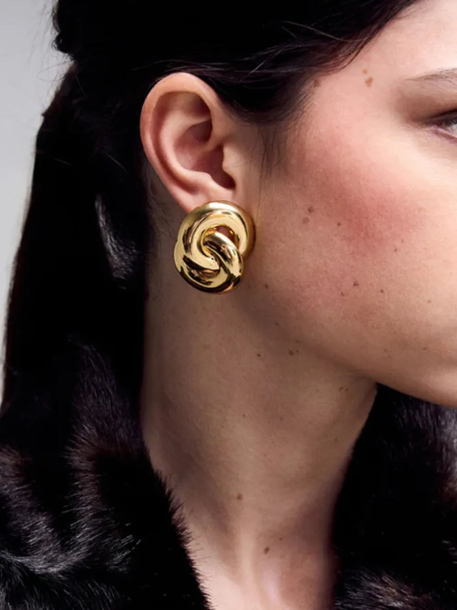 Gold interlocking knot statement earrings, 18K gold-plated.