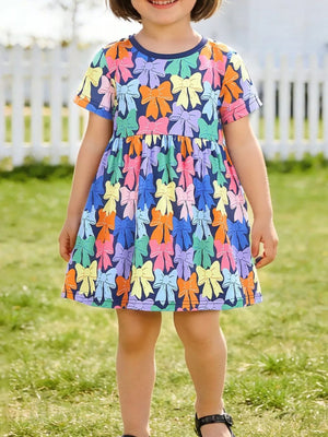 Toddler girls' a-line dress with colorful bow print, short sleeves, and round neckline.