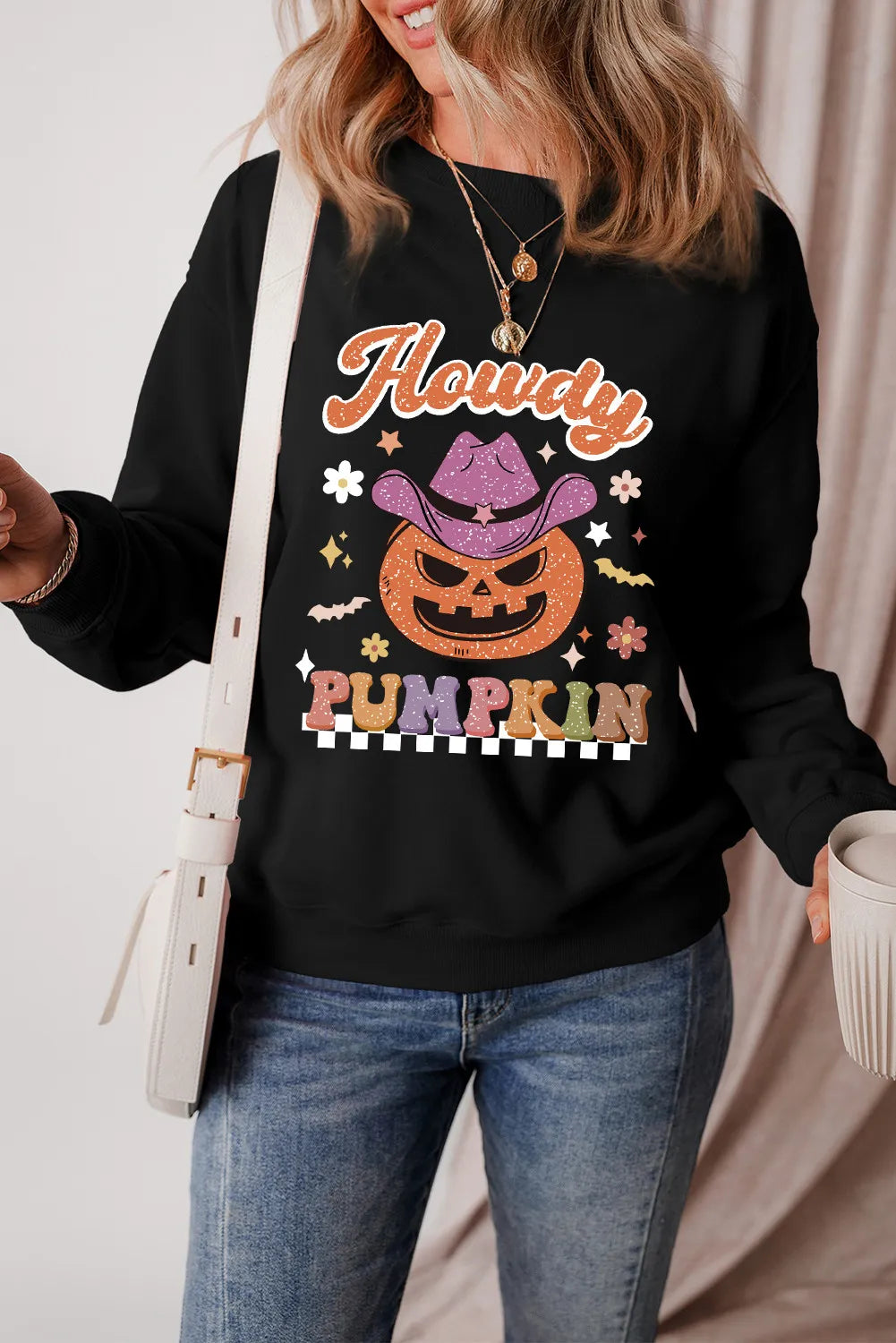 Black crewneck sweatshirt with Howdy Pumpkin graphic, cowboy hat, and fall motifs.
