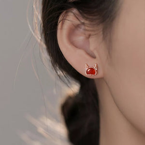 earrings in rose gold featuring deer motif and N/A fit