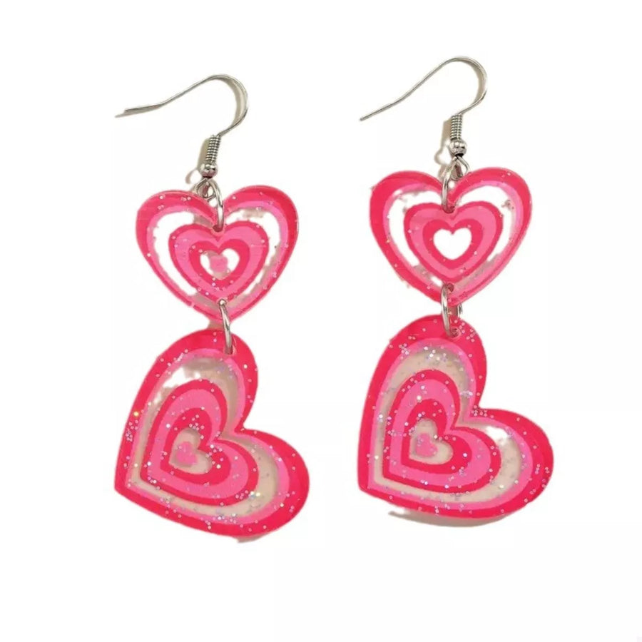 Pink layered heart dangle earrings with glitter accents