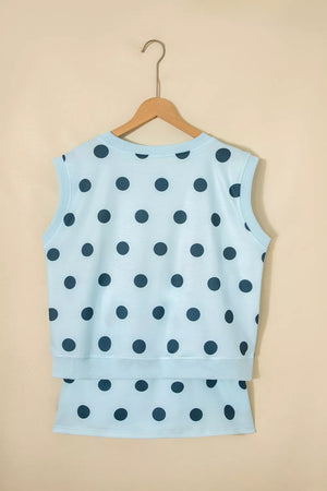 Pastel blue polka dot two-piece set with crew neck sleeveless top and skort.