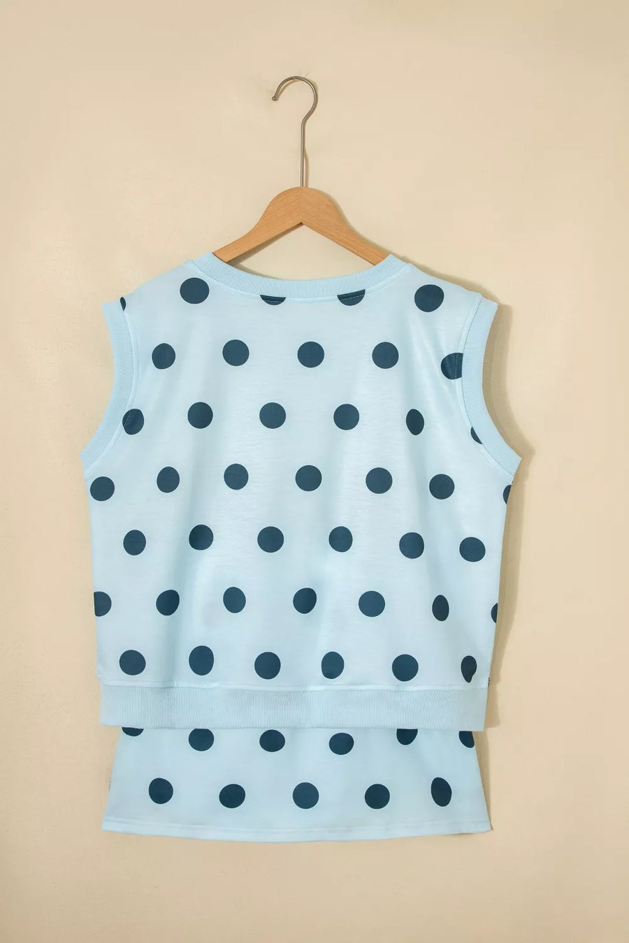 Pastel blue polka dot two-piece set with crew neck sleeveless top and skort.