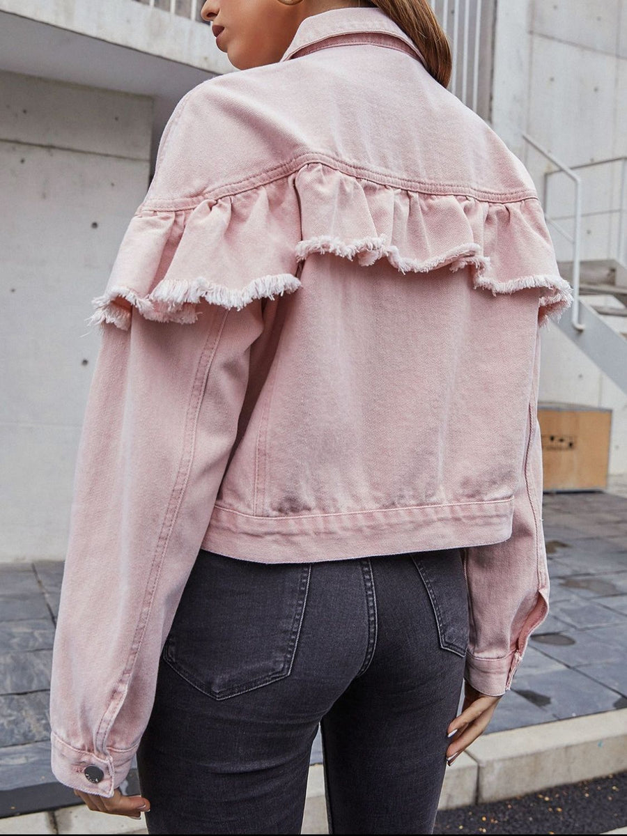 Blush pink denim trucker jacket with frayed ruffle detail across the back yoke.
