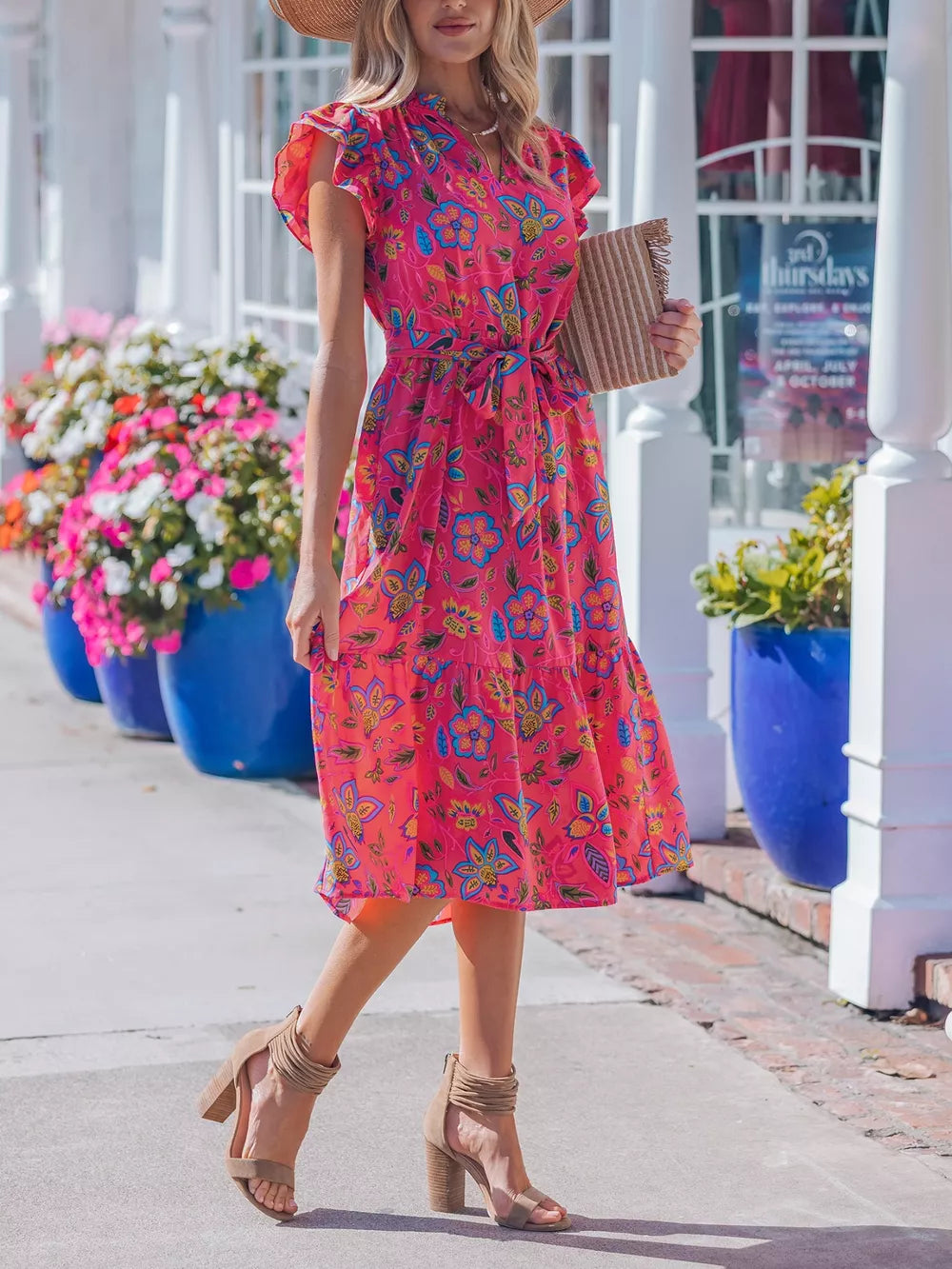 Floral midi dress with ruffled sleeves, V-neck, belted waist, and tiered hem in a cotton blend.
