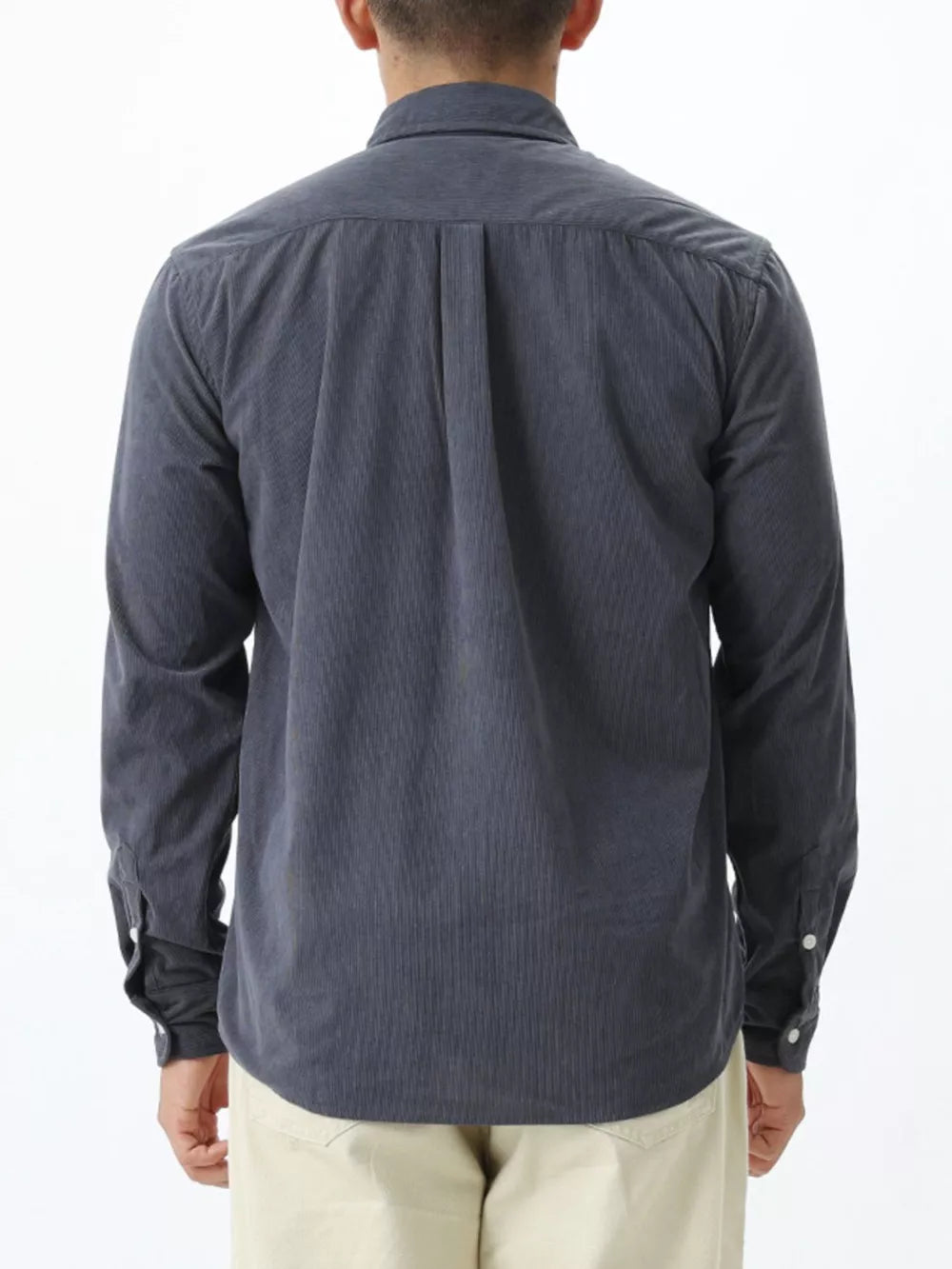 Gray corduroy long sleeve buttoned shirt with back pleats and buttoned cuffs.
