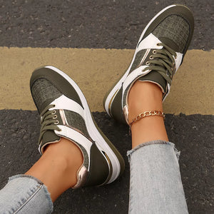 Army green lace-up sneakers with white and metallic accents, featuring a textured fabric and chunky sole.