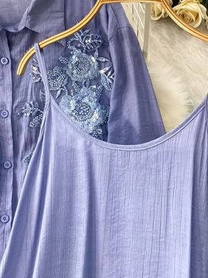 Blue embroidered floral two-piece set with sequin details and crinkled fabric.