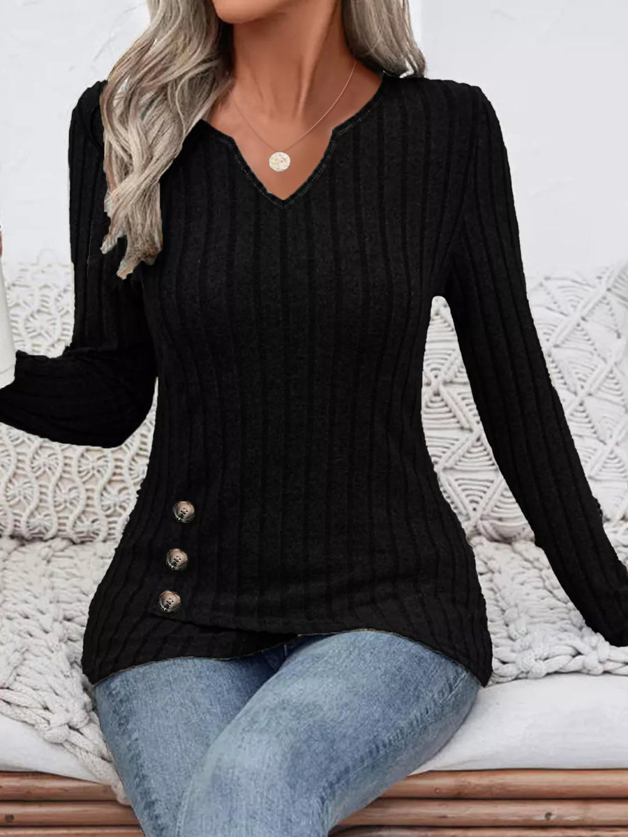 Black ribbed knit top with notched neckline and decorative buttons on the side.