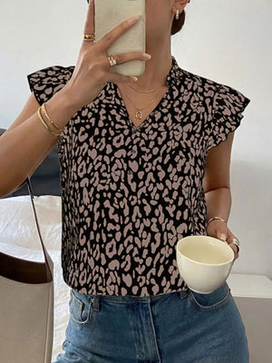 Black and tan leopard print short sleeve collared blouse with a v-neck.