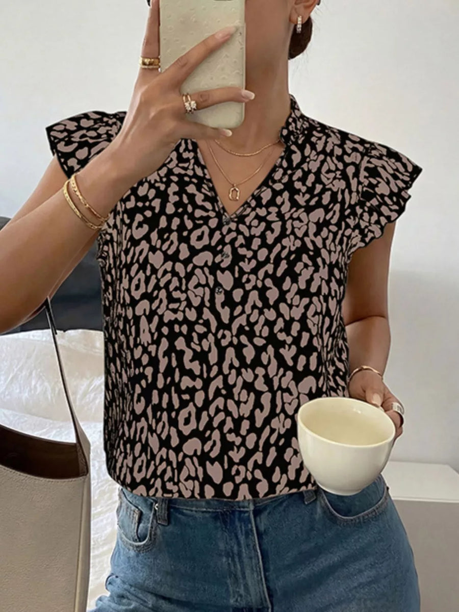 Black and tan leopard print short sleeve collared blouse with a v-neck.