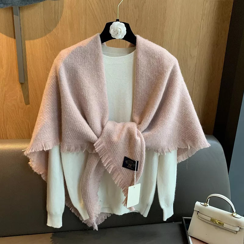 Luxurious fuzzy triangle shawl scarf in dusty pink with fringe detail, styled over a white sweater.