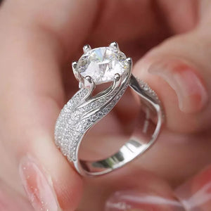 Exquisite Moissanite Solitaire Ring In Silver with pave band.