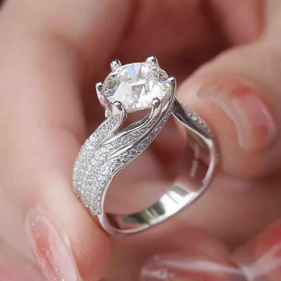 Exquisite Moissanite Solitaire Ring In Silver with pave band.