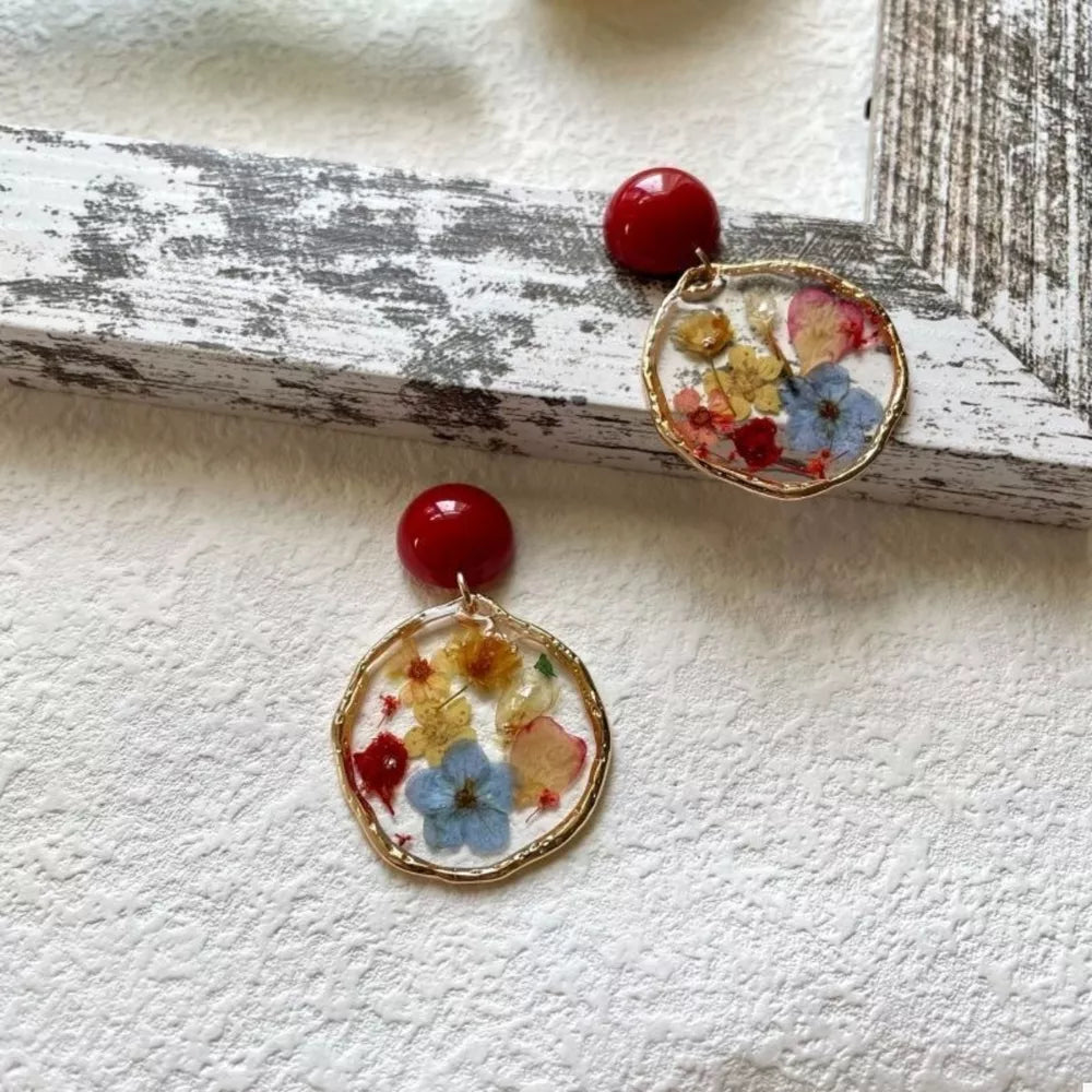 earrings in red featuring dangle and dangle fit