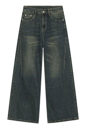 Faded dark denim wide-leg trousers with a relaxed fit and vintage wash.
