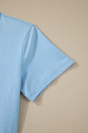 Light blue cotton V-neck top sleeve detail with double stitching.