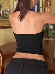 Black ribbed halter tank top with scoop neck, showing back detail.