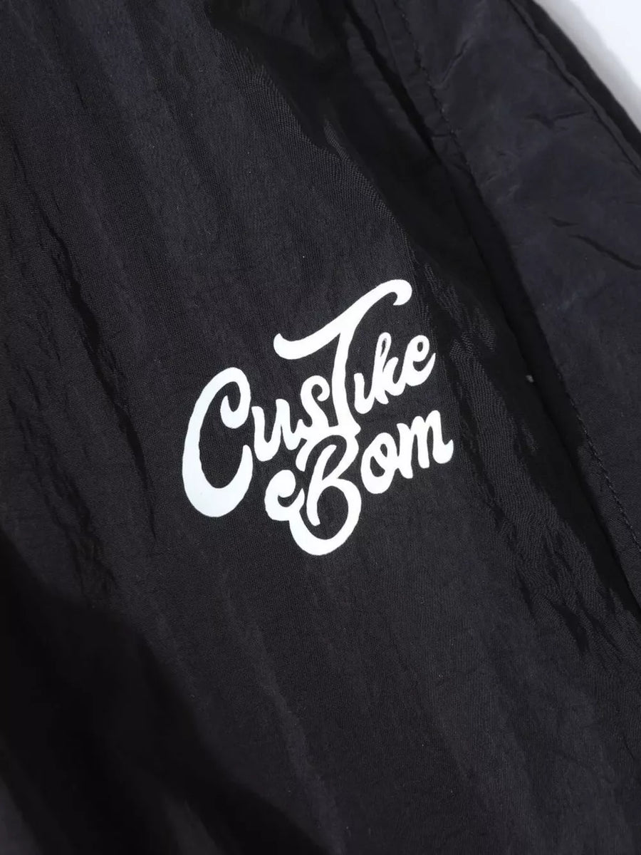 Black wide-leg cargo pants with white script logo detail