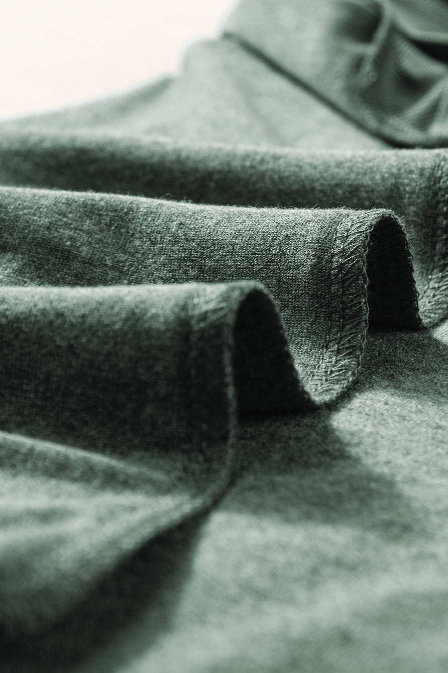 Textured dark gray sleeveless V-neck tank top with a soft, breathable fabric.