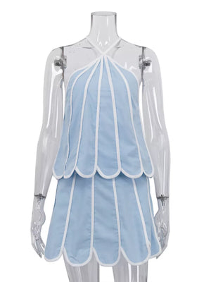 Blue halter top and skirt set with white trim and scalloped hem