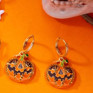earrings in black with pumpkin motif and drop earrings