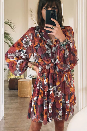 Balloon sleeve mini dress in a rich floral print with a V-neck and cinched waist.