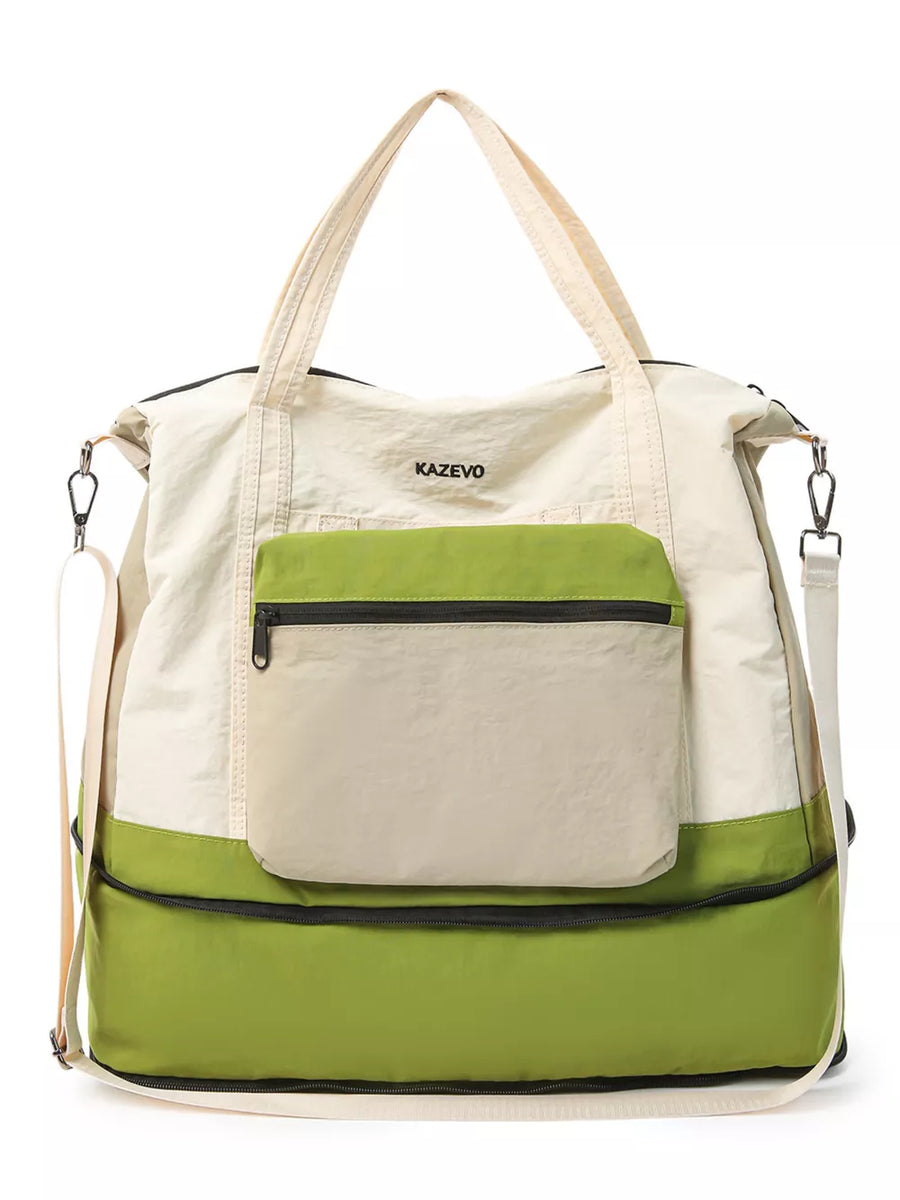 Chic nylon travel bag in cream and green with front zip pocket and adjustable straps.