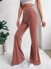 Dusty pink corduroy maternity flare pants with high waist and bell bottoms.