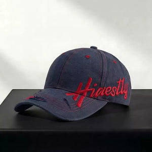 Navy cotton baseball cap with red "Honestly" embroidery and distressed details.