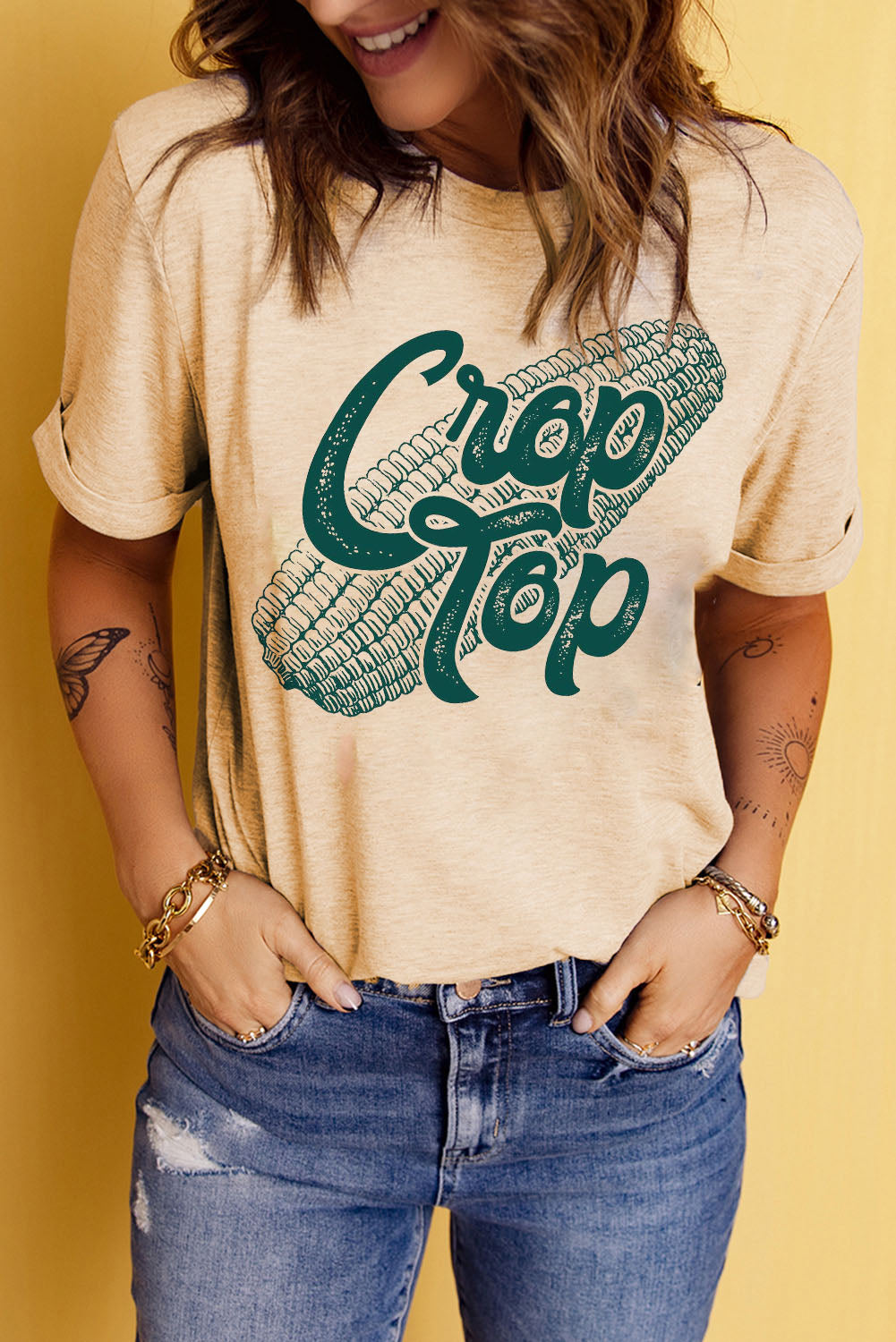 Sand crop top graphic tee with rolled sleeves and corn graphic.