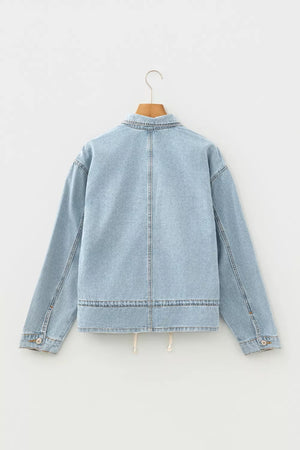 Light wash denim trucker jacket with relaxed fit and adjustable draw-cord hem.