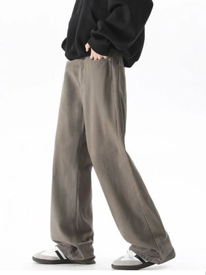 Brown wide-leg comfort fit jeans with a relaxed cut and cotton blend material.