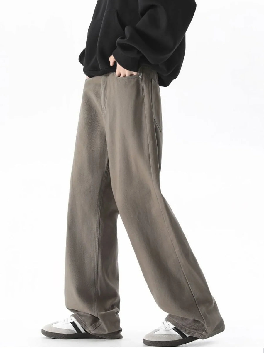 Brown wide-leg comfort fit jeans with a relaxed cut and cotton blend material.