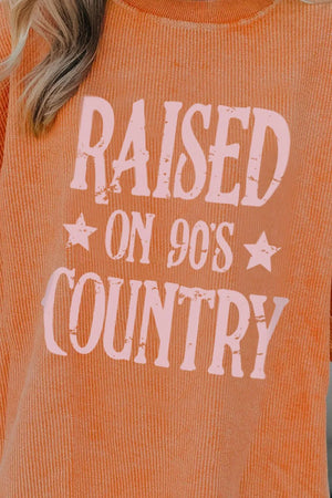 90s country graphic corded sweatshirt in sherbet with pink text.