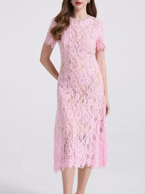 Pink lace midi dress with pearl-embellished neckline and short sleeves.