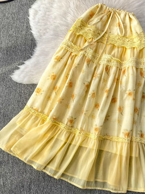 Yellow floral ruffled tiered midi skirt with lace trim and drawstring waist.