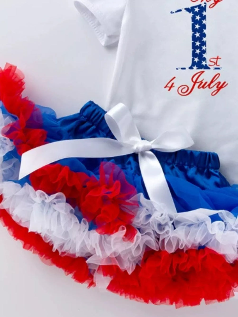 Baby outfit with white top saying 1st 4 July and red, white, blue ruffled tutu skirt.