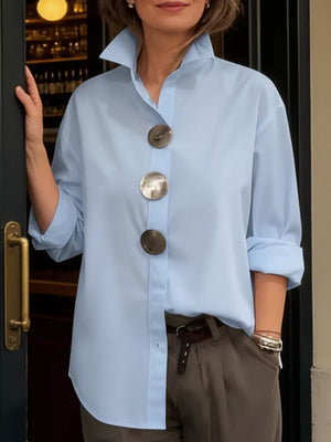 Black button-up shirt with oversized buttons and long sleeve