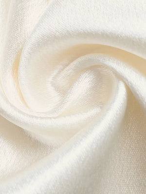 Lace-trimmed high-waist wide-leg maternity pants in beige satin with a soft sheen.