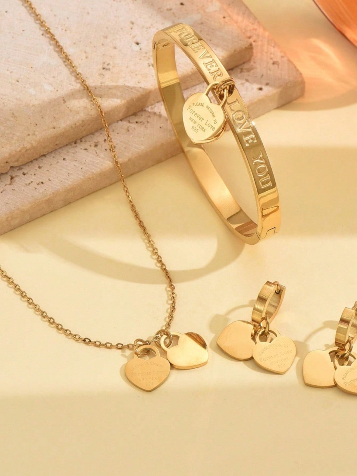 gold jewelry set with heart pendant and n/a