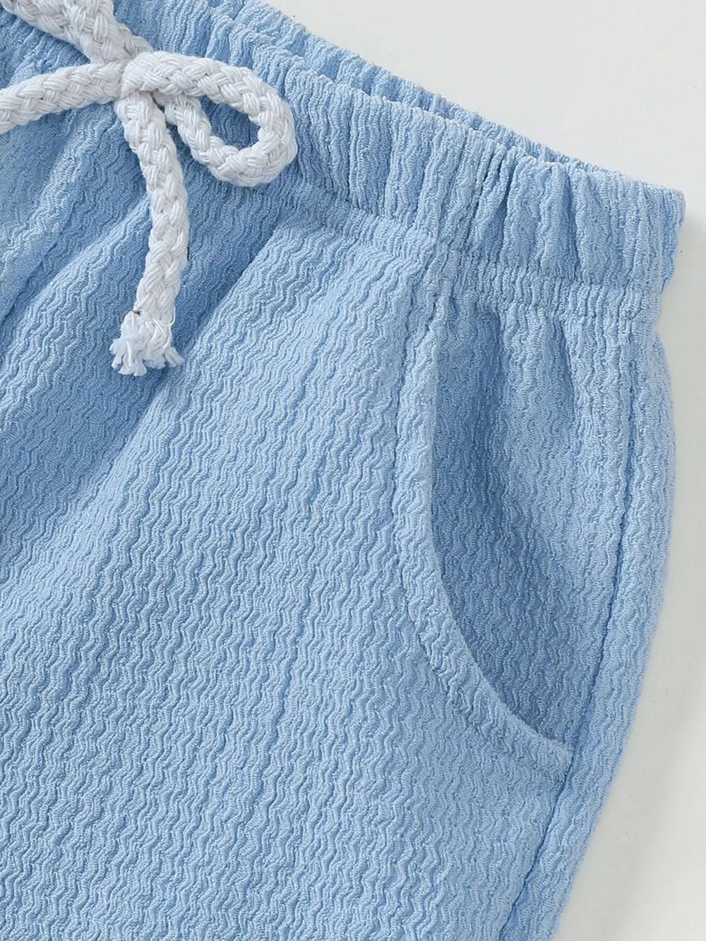 Blue ribbed baby shorts with elastic waist and drawstring detail